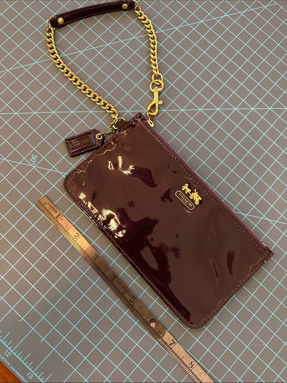 Coach Patent Wristlet in deep purple with Gold Hardware